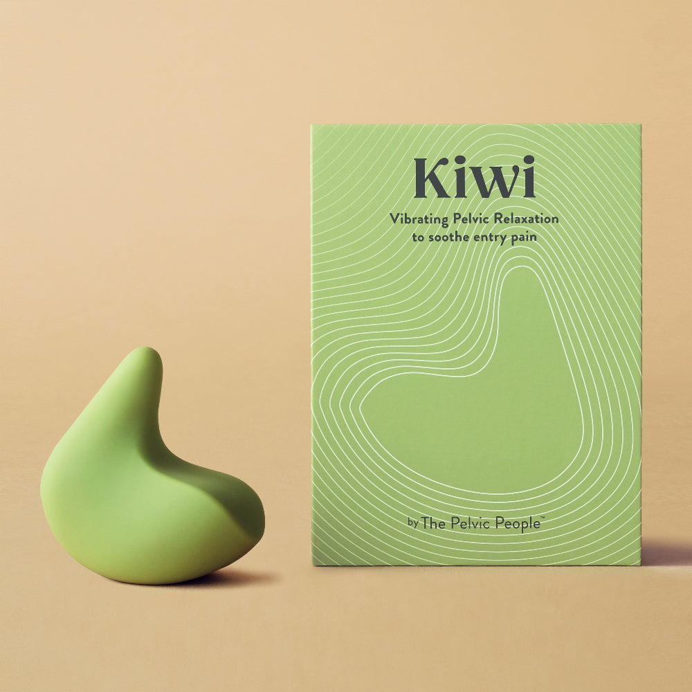Kiwi therapeutic vibrator for pelvic pain and vaginismus next to its green box in front of a plain peach background