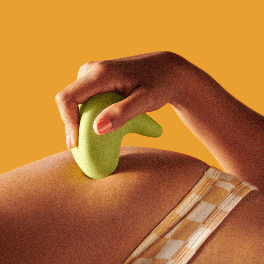 Woman holding the Kiwi vibrator by thee Pelvic people against her skin