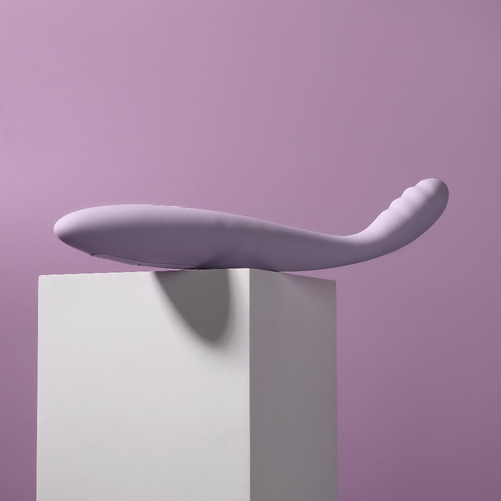 Editorial shot of the Svakom Cici 2 app-controlled vibrator set on a white plinth against a purple background