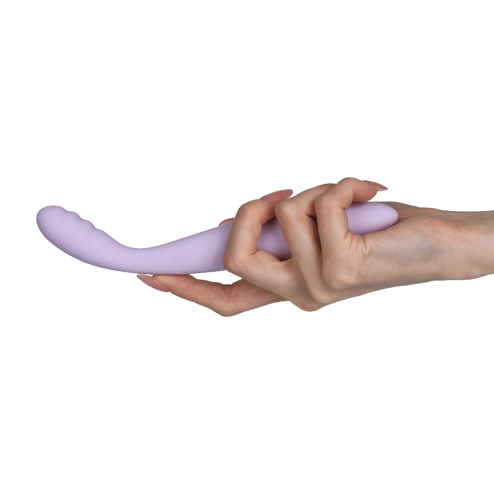 Svakom cici 2 being held in a woman's hand.
